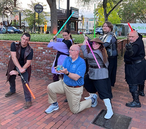 Cosplayers pose with Mayor Ward at Star Wars event