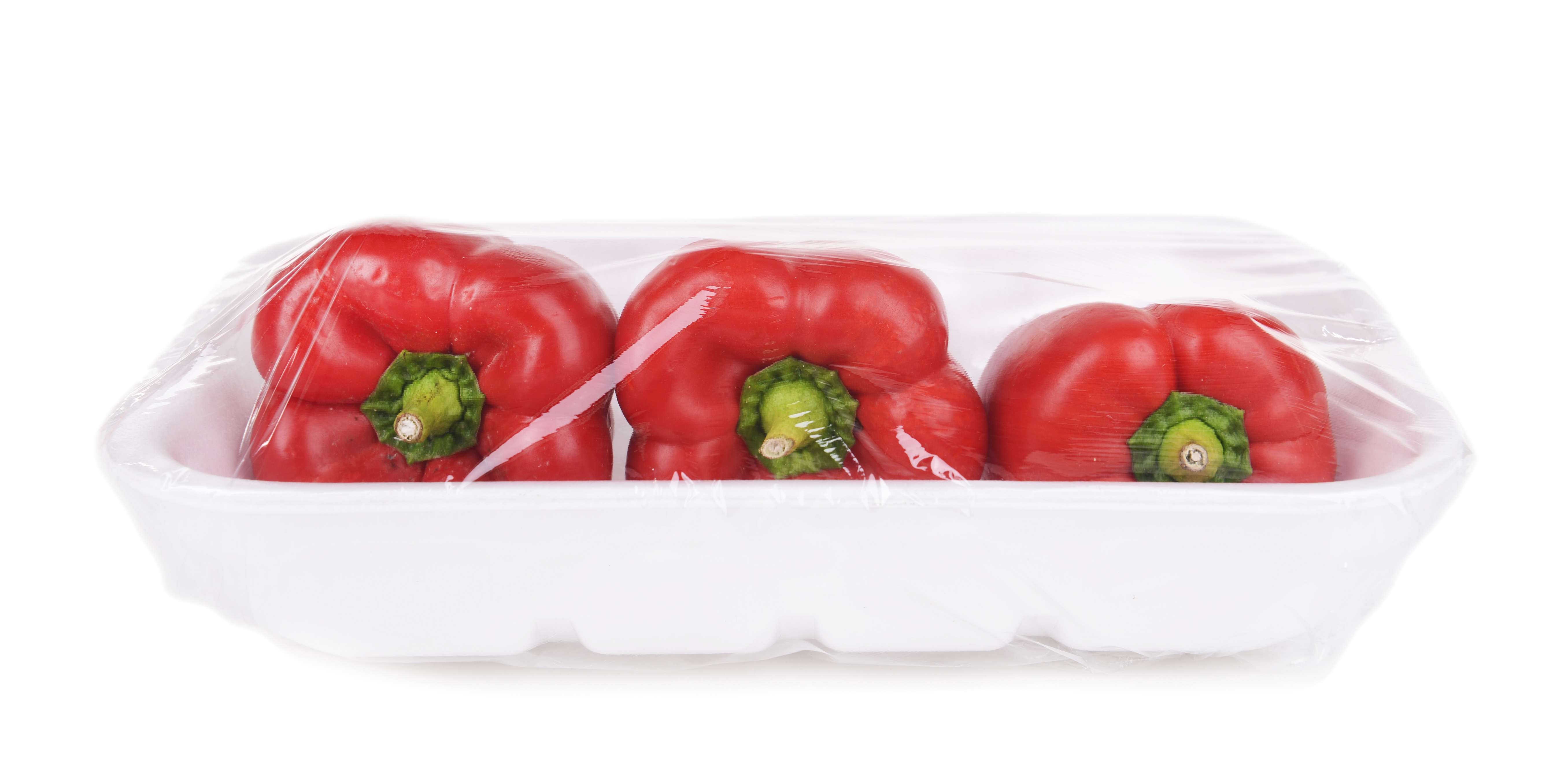 red bell peppers wrapped in plastic